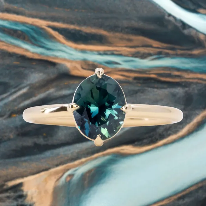 165ct Untreated Deep Teal Nigerian Oval Sapphire Four Prong Compass Set Solitaire in 18k Yellow Gold Brume PreStyled Sets 165ct Untreated Deep Teal Nigerian Oval Sapphire Four Prong Compass Set Solitaire in 18k Yellow Gold Brume PreStyled Sets