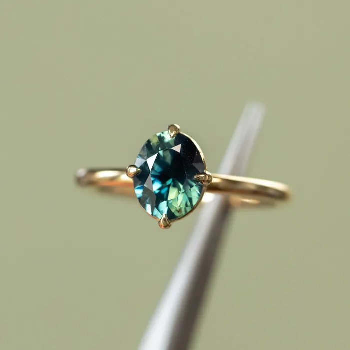 165ct Untreated Deep Teal Nigerian Oval Sapphire Four Prong Compass Set Solitaire in 18k Yellow Gold Brume PreStyled Sets