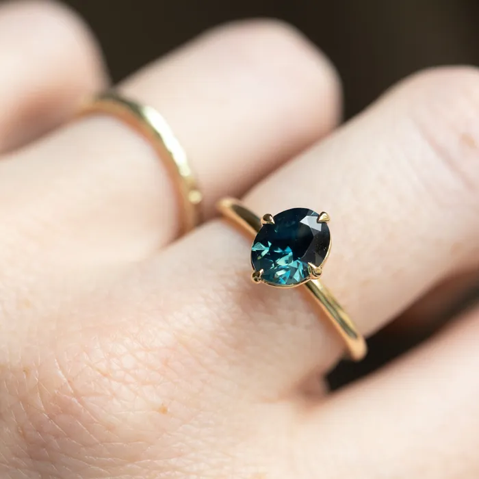 165ct Untreated Deep Teal Nigerian Oval Sapphire Four Prong Compass Set Solitaire in 18k Yellow Gold Brume PreStyled Sets
