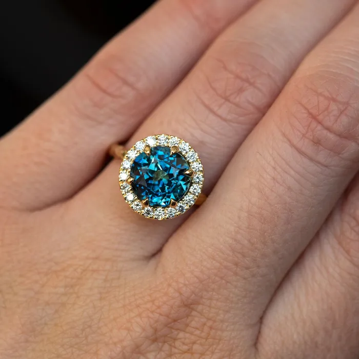 427ct Blue Madagascar Sapphire Six Prong Halo Evergreen Ring in 18k yellow gold Anueva Jewelry Rings