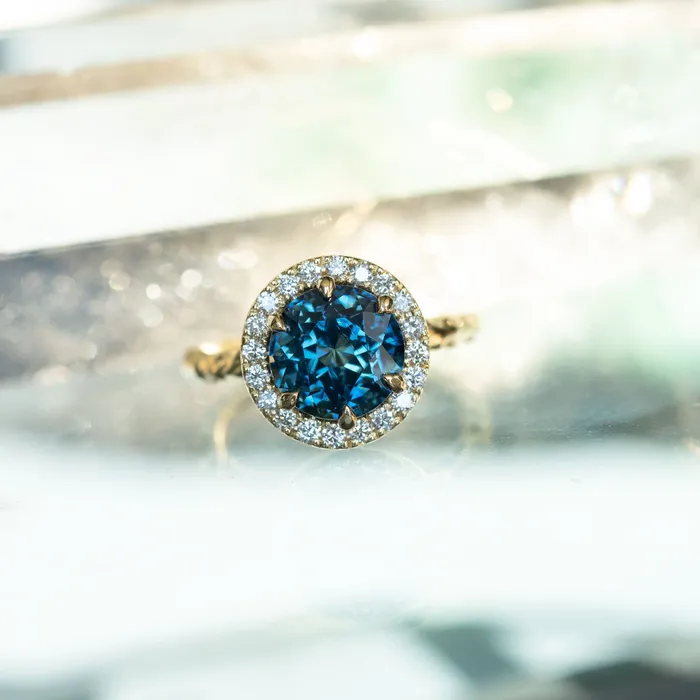 427ct Blue Madagascar Sapphire Six Prong Halo Evergreen Ring in 18k yellow gold Anueva Jewelry Rings