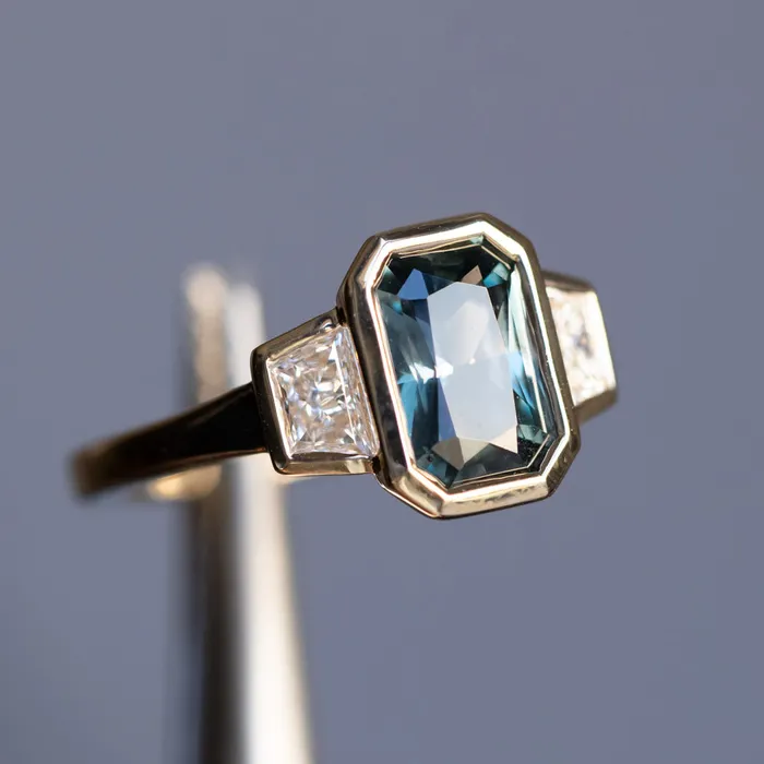Rings 202ct Untreated Radiant Cut Color Shifting Sapphire and White Diamond Three Stone Bezel Set Ring in 14k Yellow Gold NASHAN